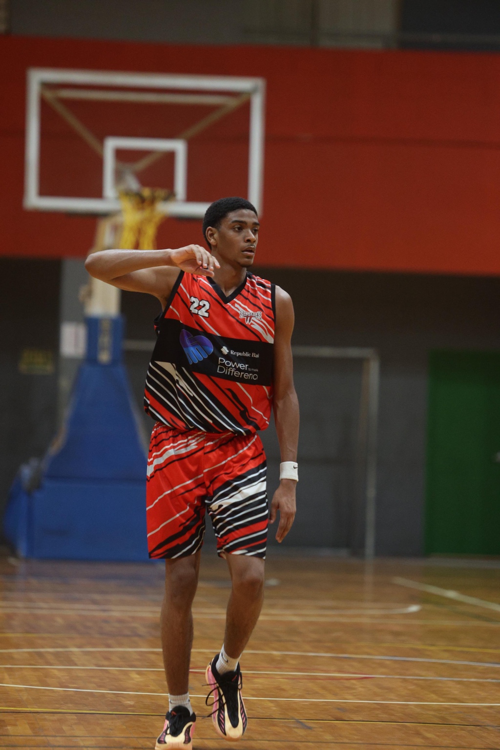 William Francis on court in the red and black Spartans TT number 22 uniform