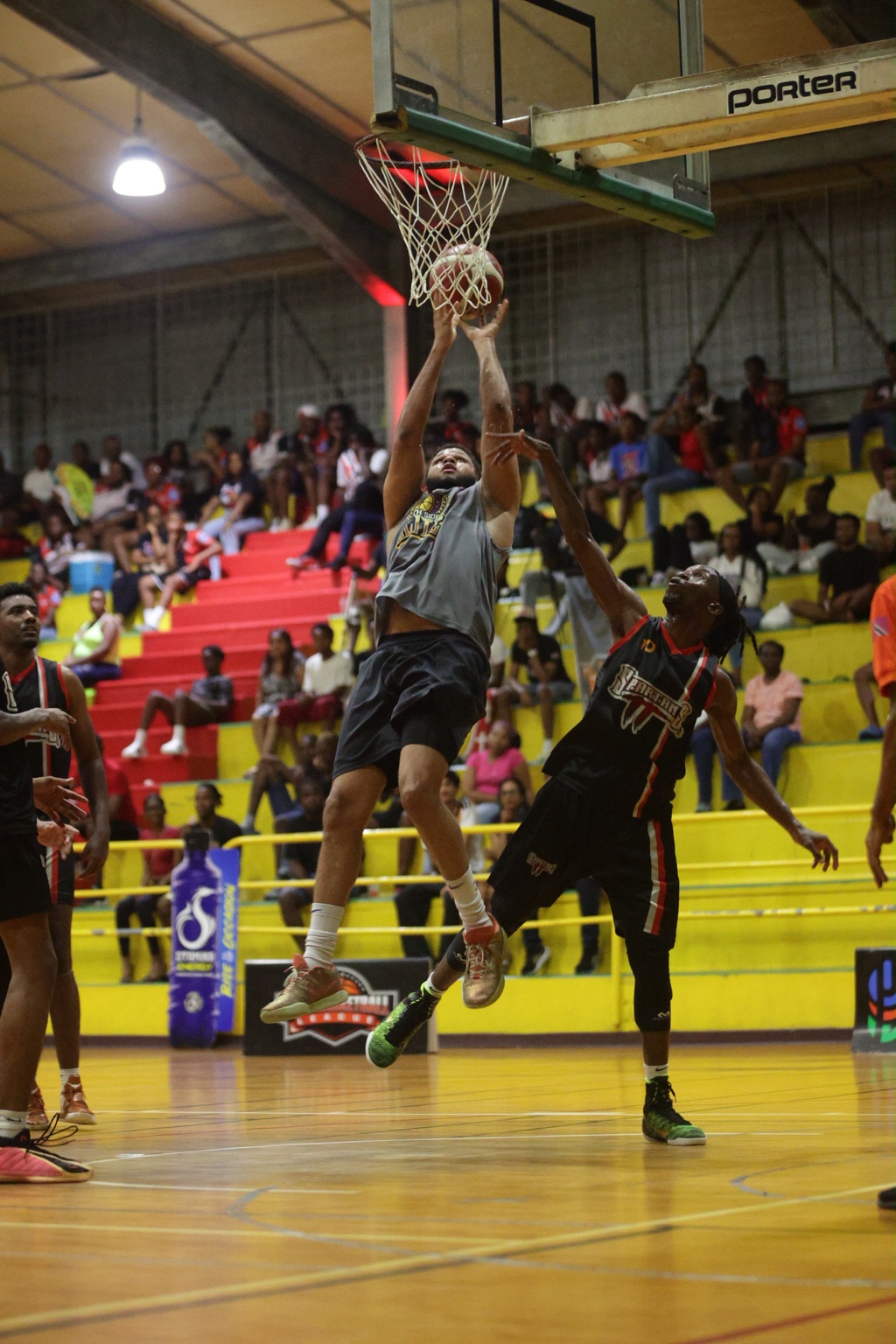 Jovan George of Southside Elite attacks the basket against Spartans TT in their first-round meeting